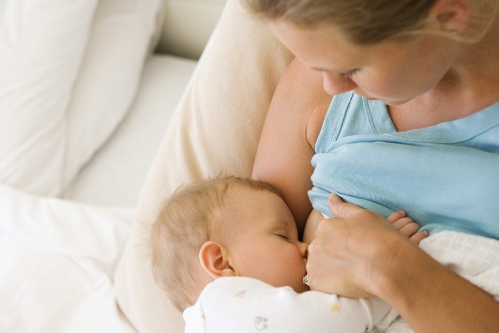 Mother breastfeeding child Mother breastfeeding child